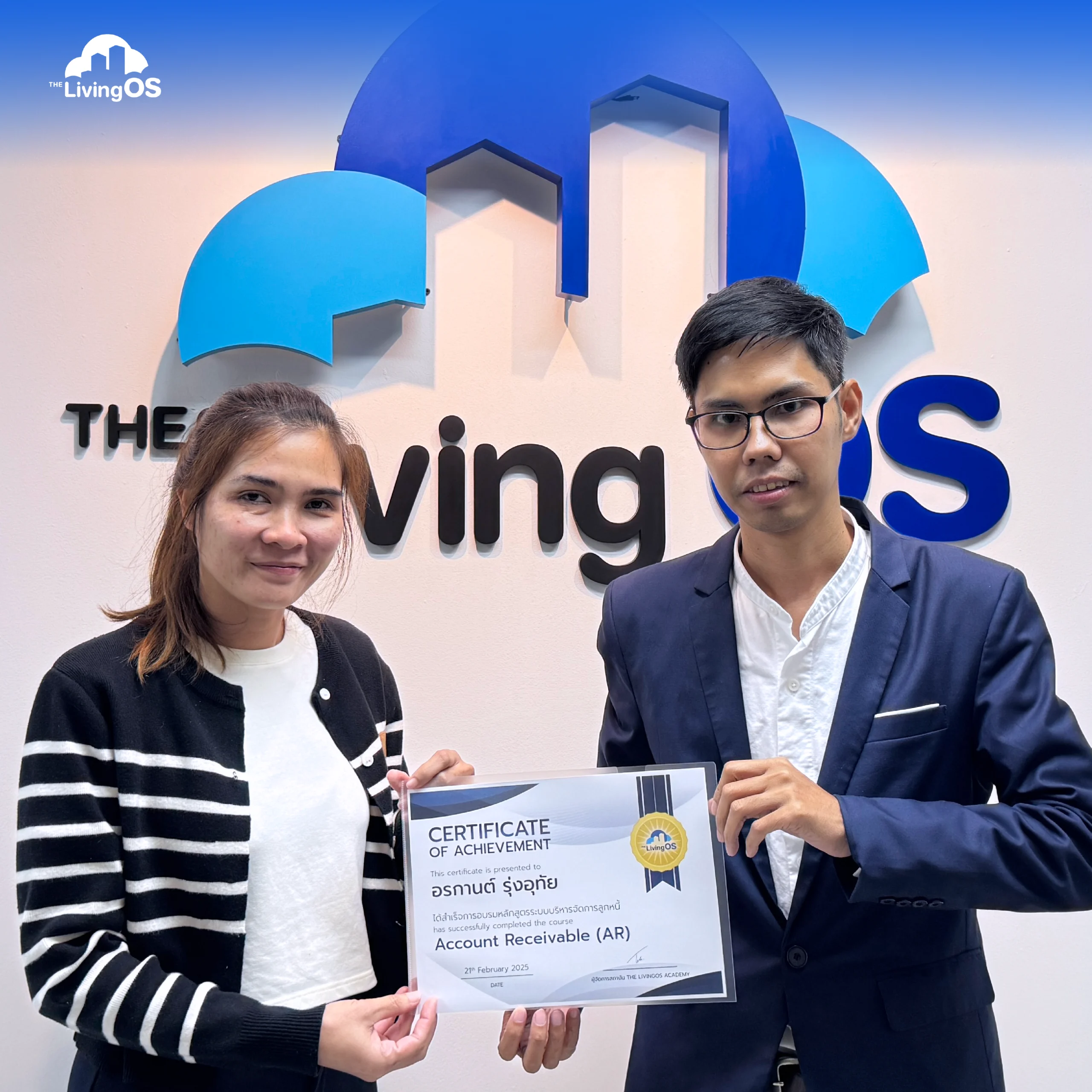 A LivingOS Academy graduate receiving a certificate of achievement
